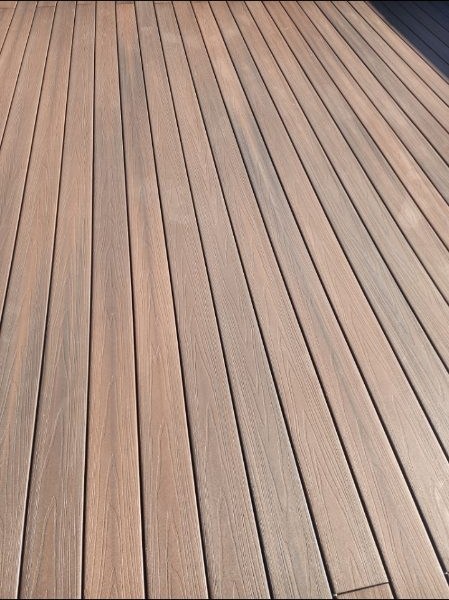 Close-up of finished wood-look deck boards after installation